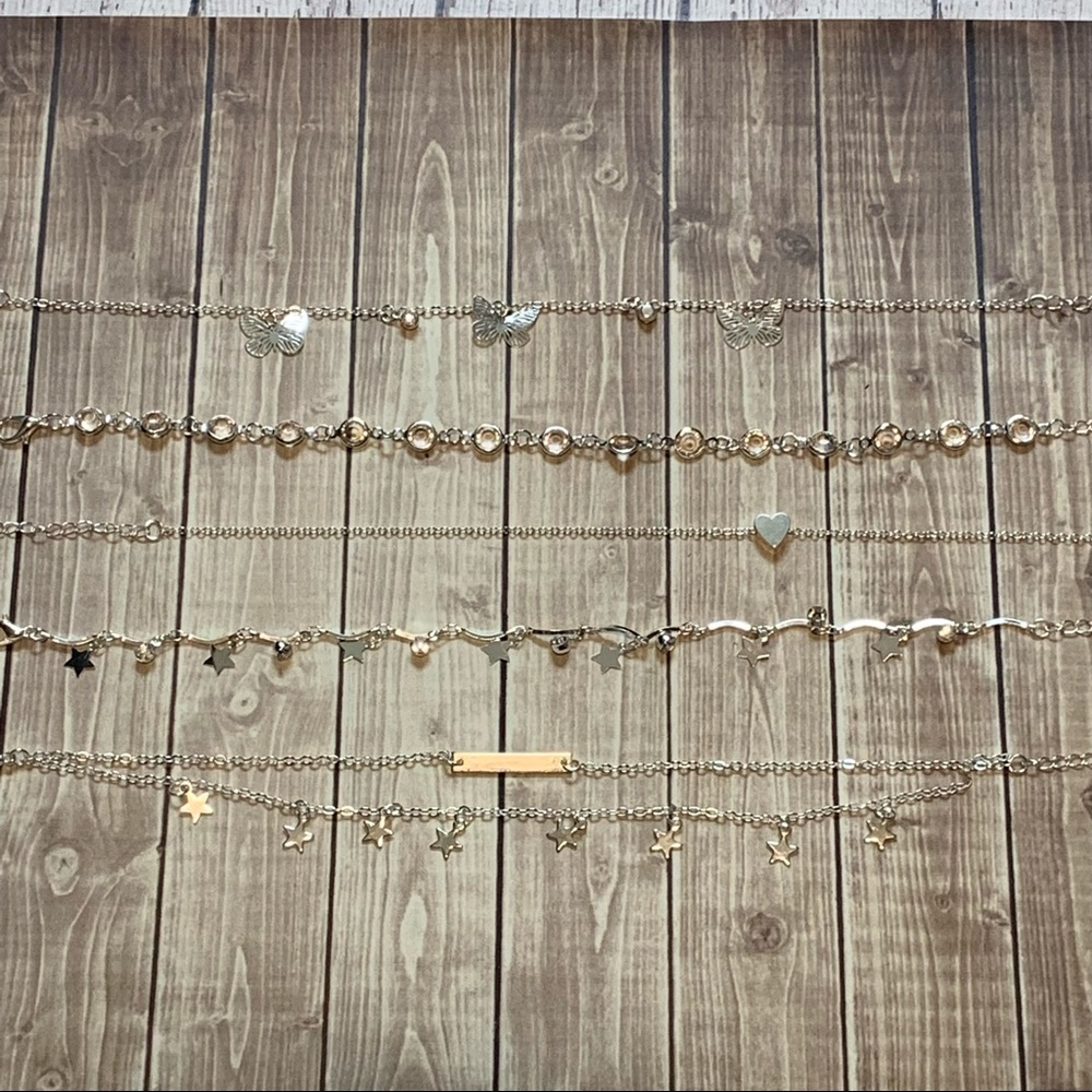 Set of 5 silver tone anklets. Stars rhinestones butterflies.